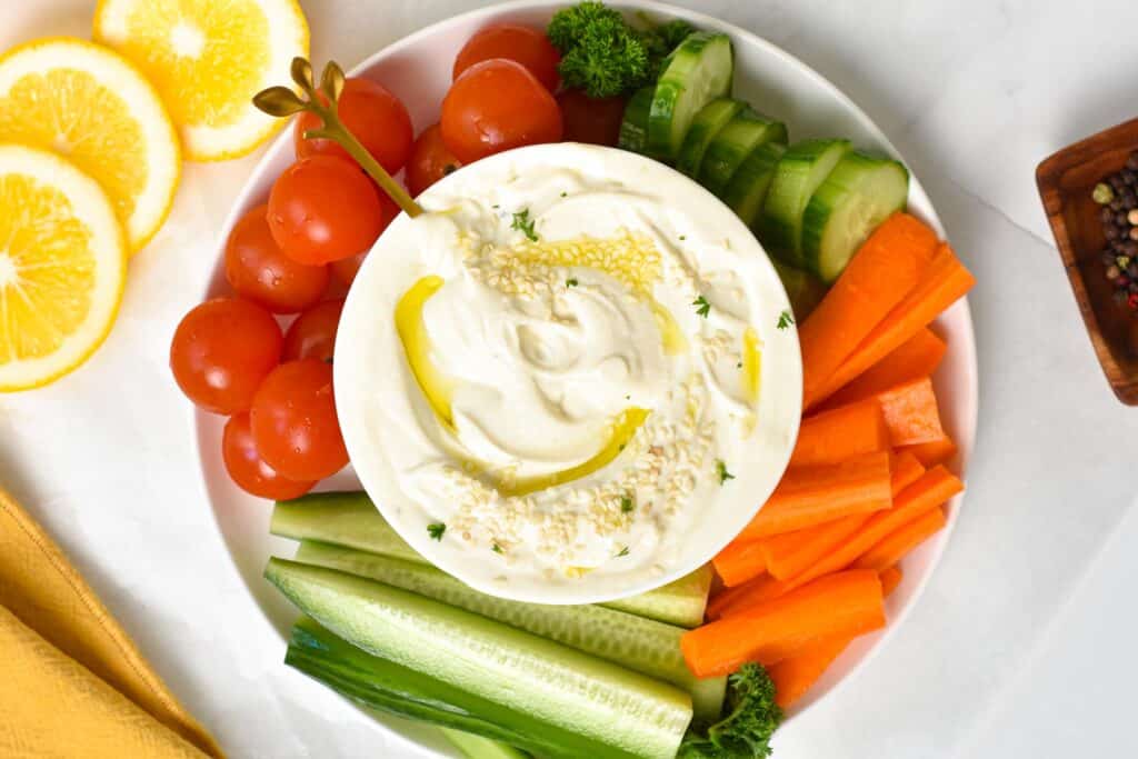 This Creamy Tahini Yogurt Sauce is the best dressing for salad or dips for your appetizer platter. It's low in calories, high in protein, and packed with lemon garlic flavors that are so refreshing.This Creamy Tahini Yogurt Sauce is the best dressing for salad or dips for your appetizer platter. It's low in calories, high in protein, and packed with lemon garlic flavors that are so refreshing.