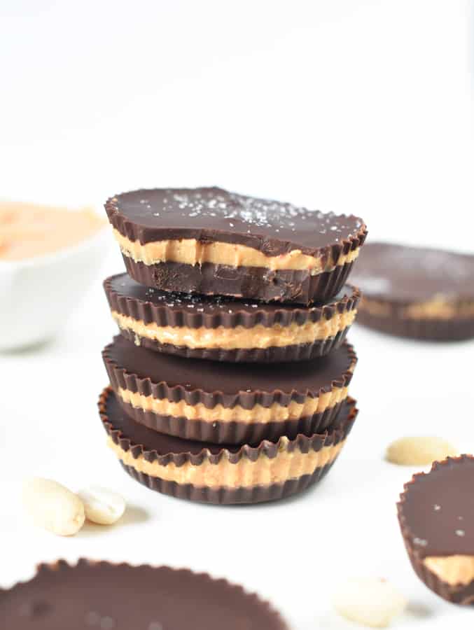 Four vegan peanut butter cups stacked on top of each other.