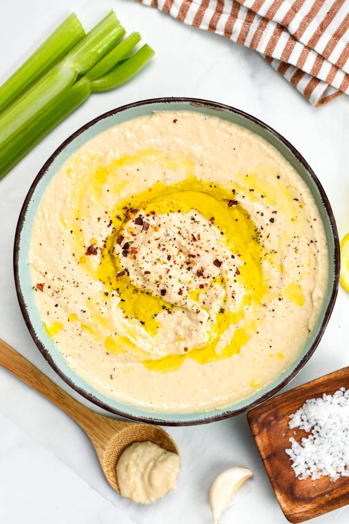 This White Bean Hummus aka white bean dip is creamy with a rich garlic lemon flavors. It's made from white beans instead of chickpeas, which adds an ultra creamy texture to the dip.