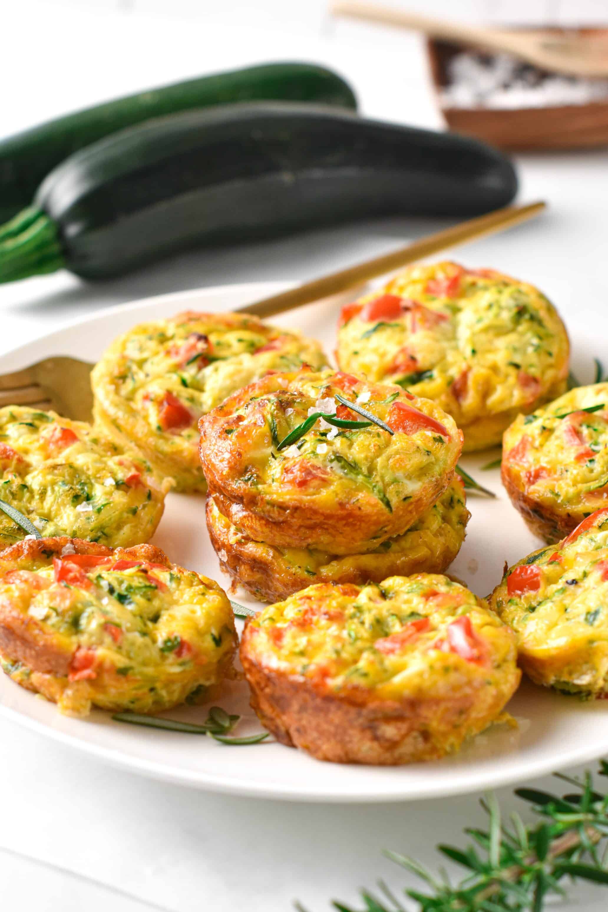 These Zucchini Egg Muffins are delicious high-protein summer breakfast muffins packed with vegetables. They are the best way to meal days of protein breakfast while using a bunch of summer zucchini.