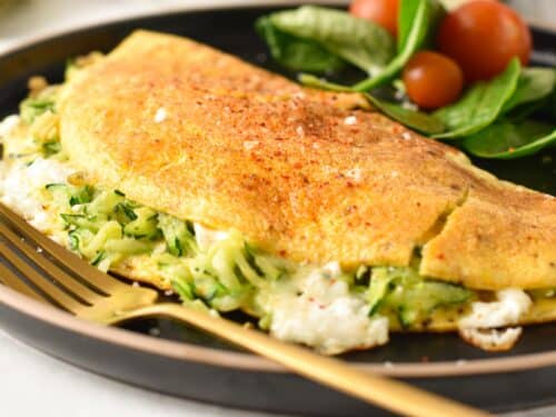 a zucchini omelette filled with feta and Parmesan