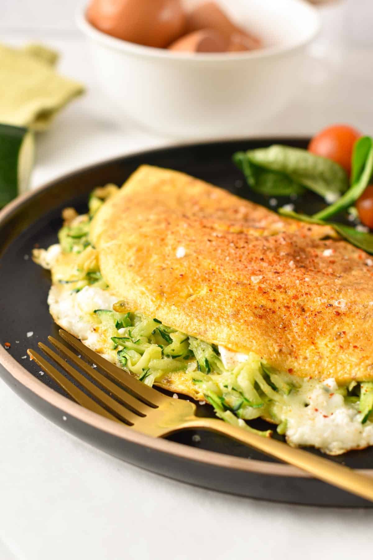 An omelette filled with grated zucchini and cheese.
